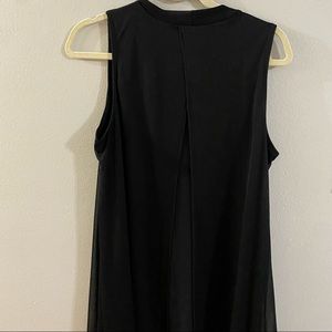Black sleeveless dress with sheer overlay